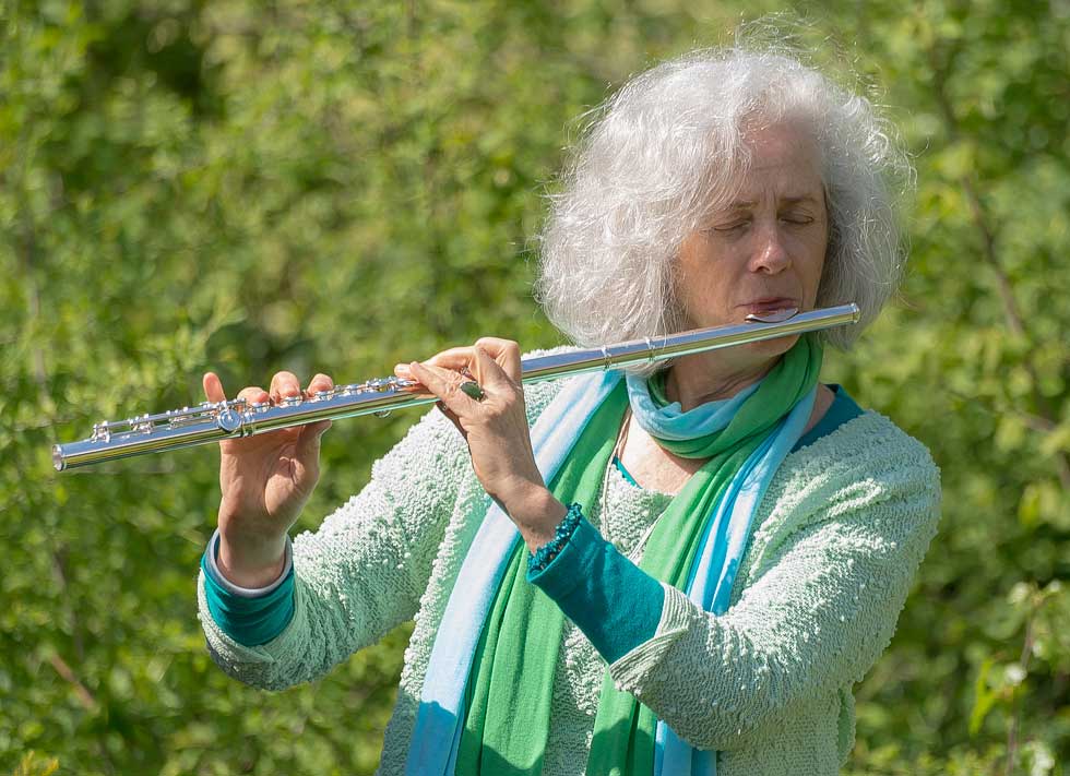 Nandin playing flute